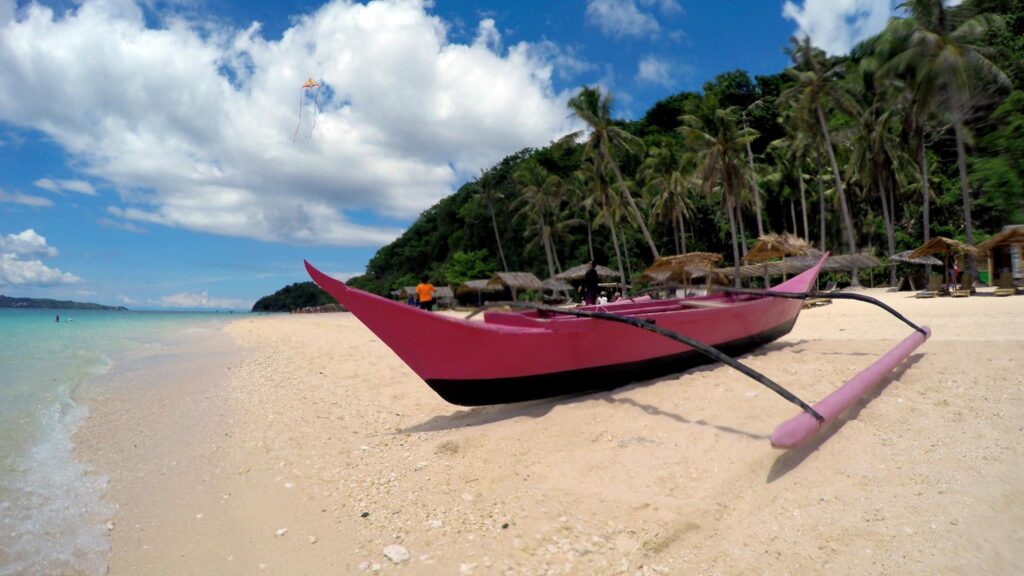 You see all manner of craft pull up to the shores of Puka Beach— at Puka Beach, Boracay Island