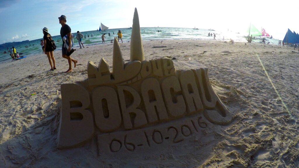 I watched a guy build this... completely out of sand. No hidden base or props; just pure skill, water and lots of fine chiseling with his hands. Incredible! Everyone on the beach is starting to find a spot to ready for the sunset in about an hour...— at White Beach, Boracay.