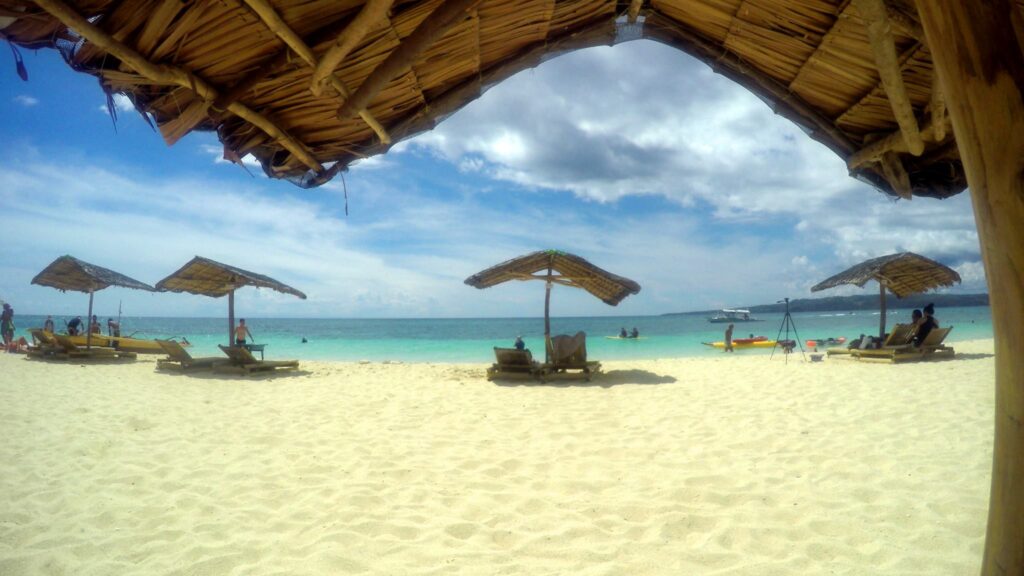 Sipping cocktails on Puka Beach— at Puka Beach, Boracay Island.